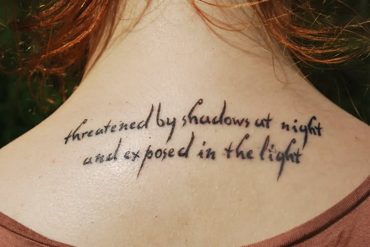 Threatened By Shadows At Night And Exposed In The Light Quote Tattoo On Upper Back