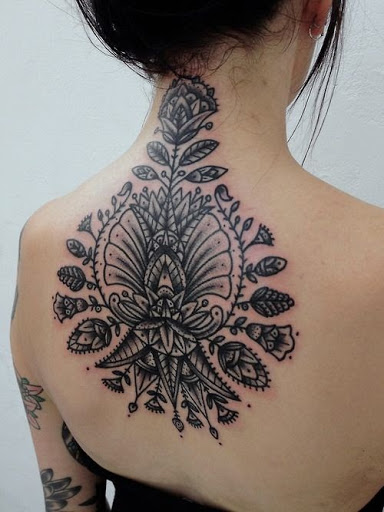 Unique Black Ink Flowers Tattoo On Upper Back