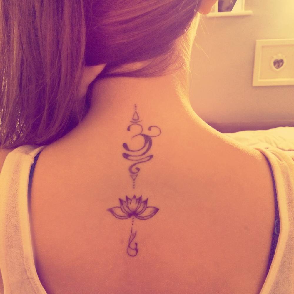 Unique Om With Lotus Flowers Tattoo On Girl Upper Back
