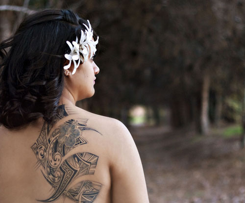 Unique Tribal Design Tattoo On Girl Upper Side Back