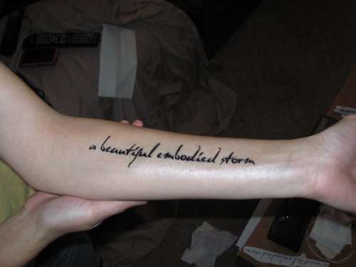 A Beautiful Embodied Storm Word Tattoo On Left Forearm