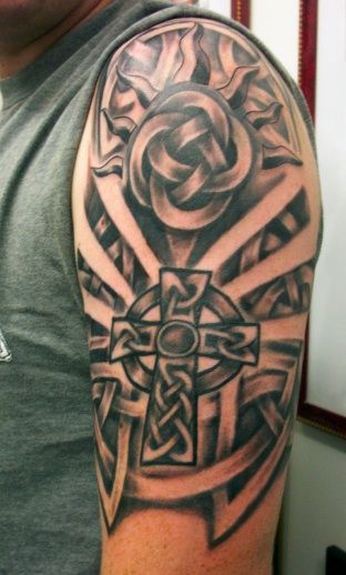 Amazing Black Ink Celtic Cross Tattoo On Man Left Half Sleeve