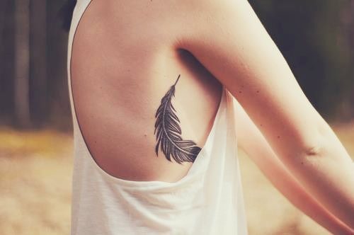Amazing Feather Tattoo On Right Side Rib