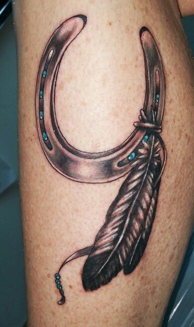 Amazing Grey Feather And Horse Shoe Tattoo