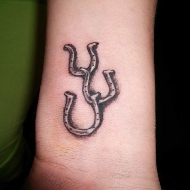 Amazing Grey Ink Horse Shoe Tattoos On Wrist