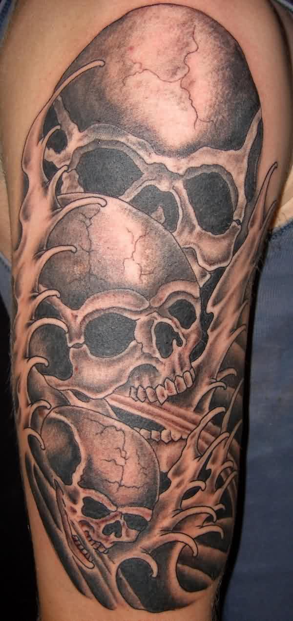 Amazing Three Skulls Tattoo Design For Half Sleeve