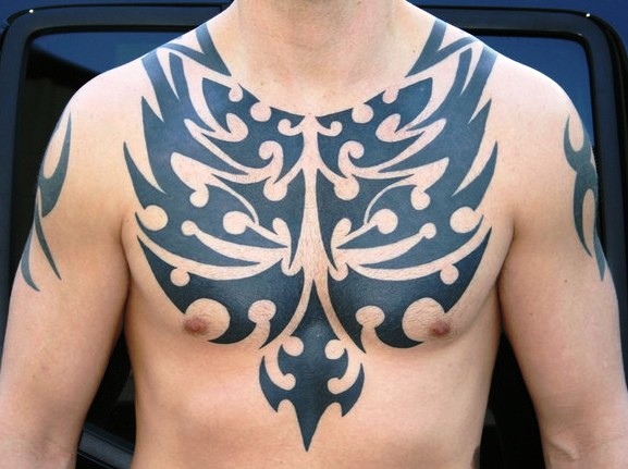 Attractive Tribal Design Tattoo On Man Chest