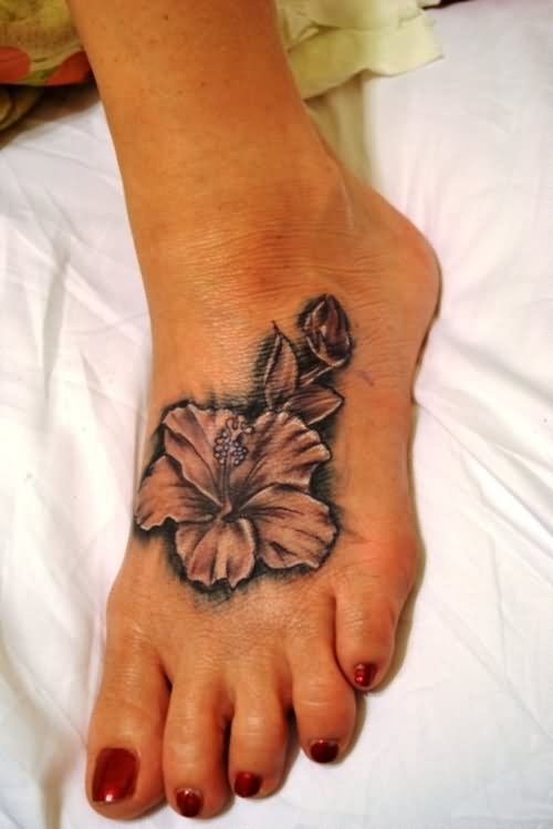 Black And Grey Hibiscus Flower Tattoo On Girl Foot