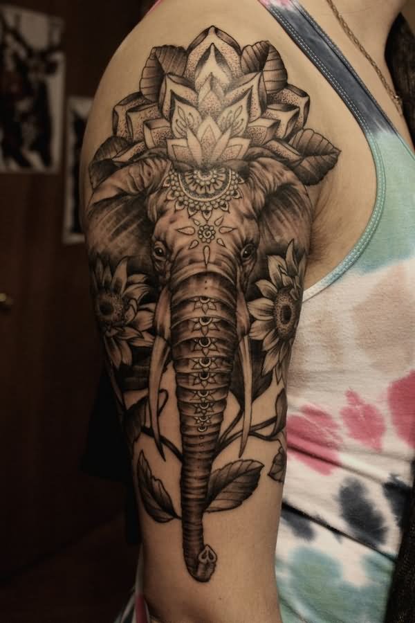 Black And Grey Indian Elephant Face With Flowers Tattoo On Right Half Sleeve