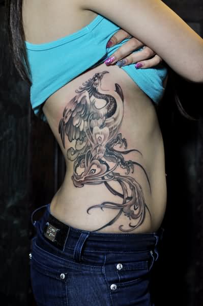 Black And Grey Phoenix Tattoo On Right Side Rib