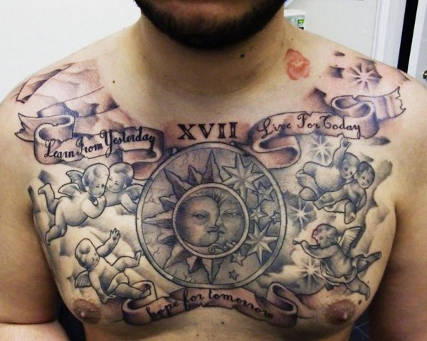 Black And Grey Sun With Cherub And Banner Tattoo On Man Chest