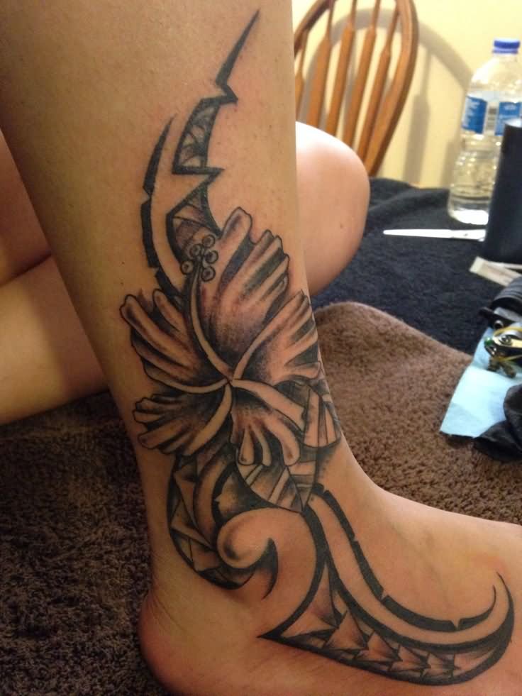 Black And Grey Tribal Hibiscus Tattoo On Leg