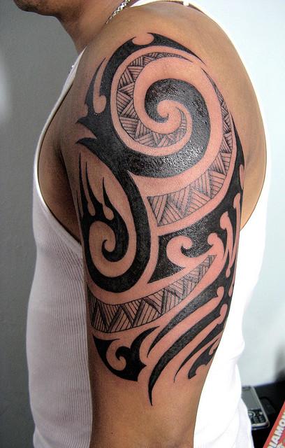 Black And Grey Tribal Tattoo On Left Half Sleeve