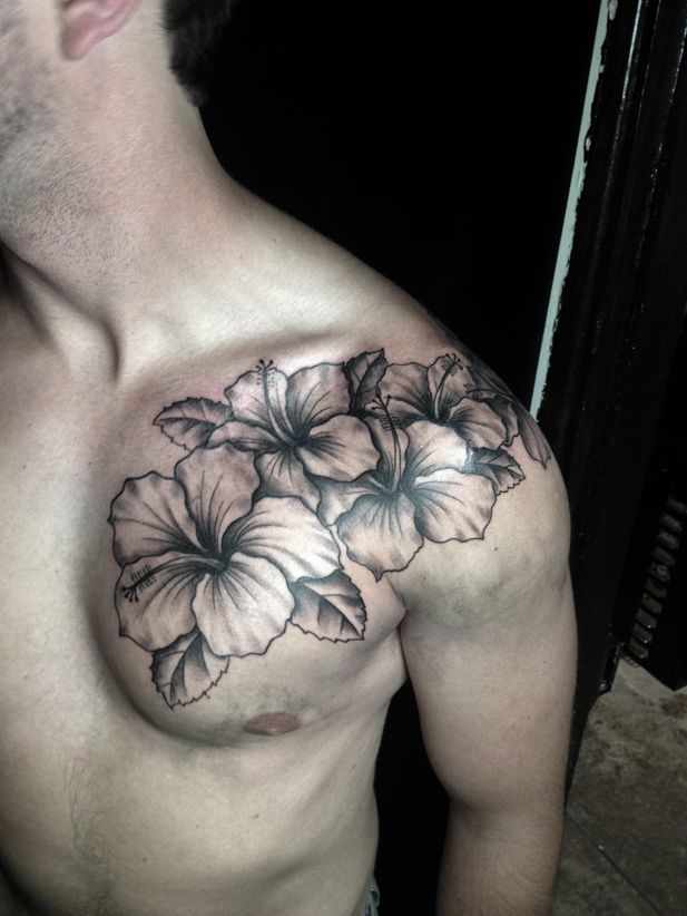 Black And White Hibiscus Flower Tattoo On Man Left Front Shoulder