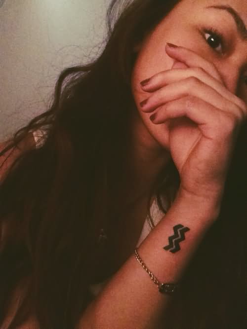 Black Aquarius Zodiac Symbol Tattoo On Wrist