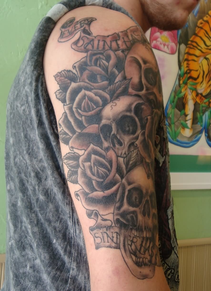 Black Ink Skulls With Roses And Banner Tattoo On Right Half Sleeve