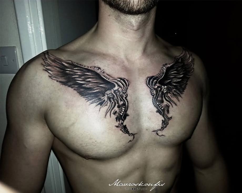 Black Ink Wings Tattoo On Man Chest