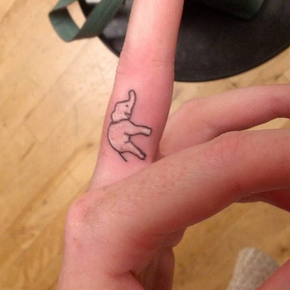 Black Outline Baby Elephant Tattoo On Finger