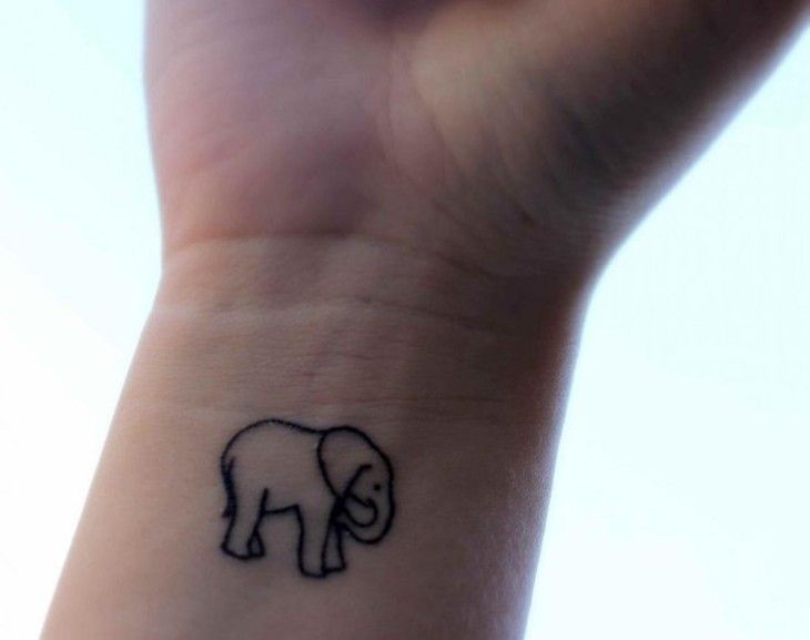 Black Outline Baby Elephant Tattoo On Wrist