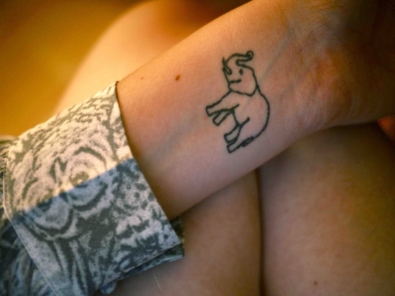 Black Outline Elephant Trunk Up Tattoo On Wrist By Cameran DeLoach