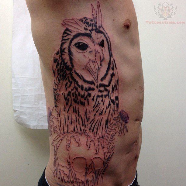 Black Owl With Skull Tattoo On Man Right Side Rib
