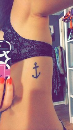Black Small Anchor Tattoo On Girl Side Rib