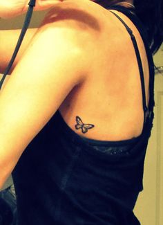 Black Small Butterfly Tattoo On Left Side Rib