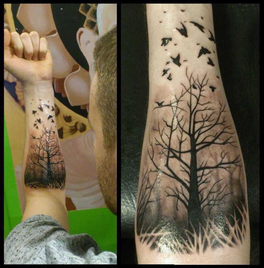 Black Tree Without Leaves With Flying Birds Tattoo On Left Forearm