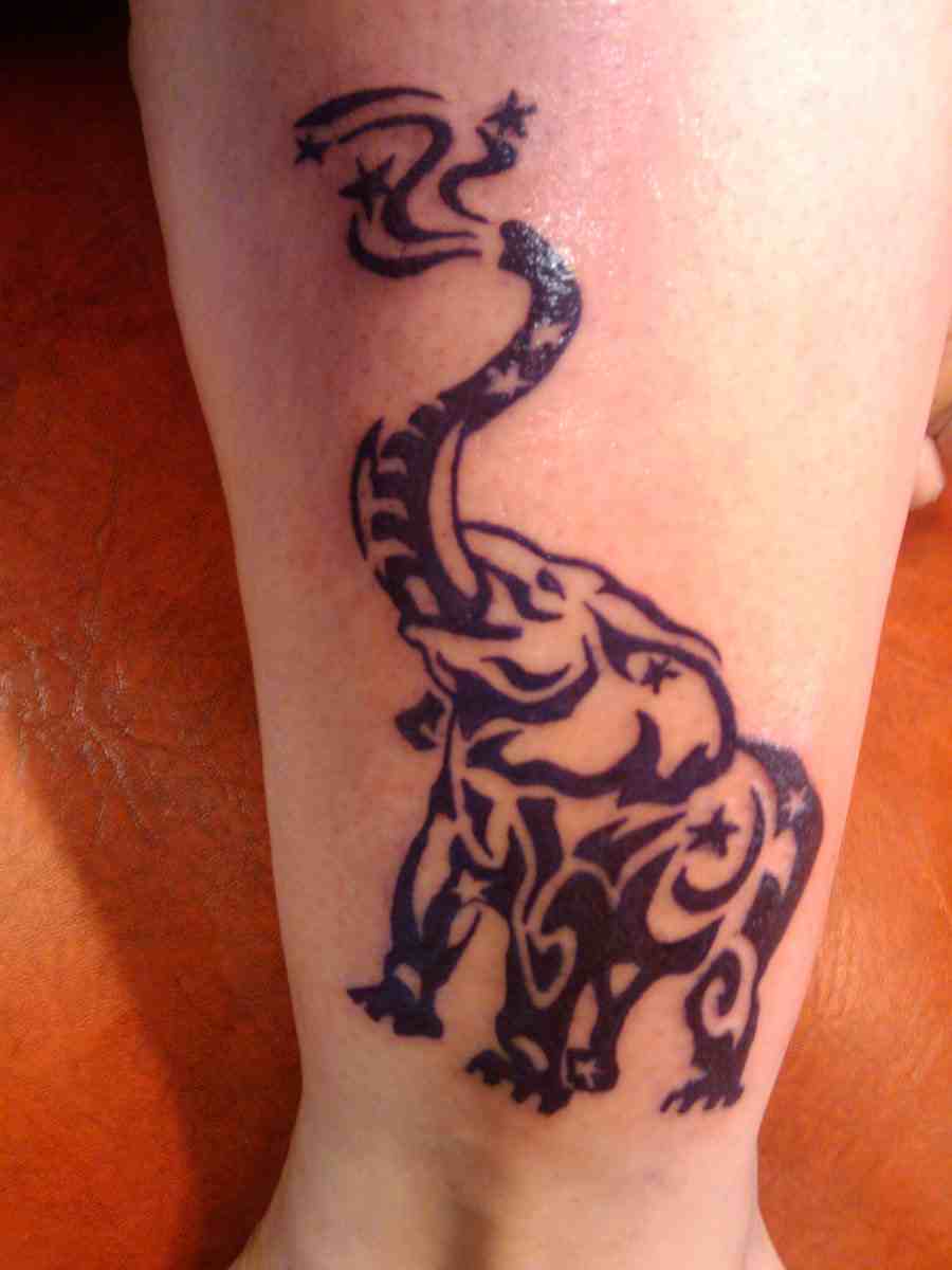 Black Tribal Elephant Trunk Up Tattoo Design For Leg