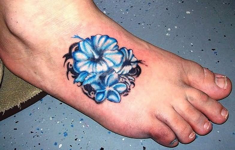 Blue Ink Hibiscus Flowers With Tribal Design Tattoo On Foot
