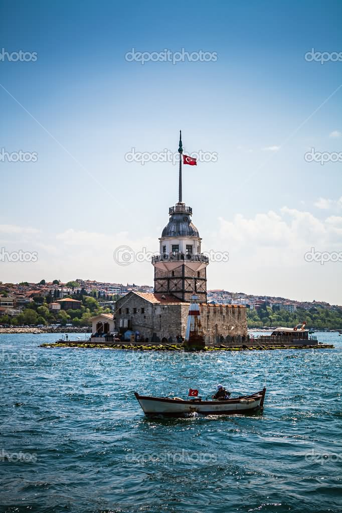 Boat Passing Near The Maiden's Tower In Istanbul