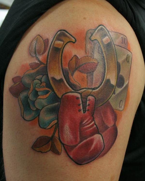 Boxing Gloves And Horseshoe Tattoo On Shoulder