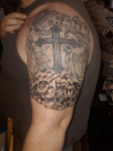 Classic Grey Ink Cross Tattoo On Man Left Half Sleeve