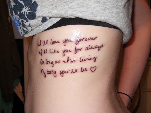 Classic Quote Tattoo On Girl Side Rib
