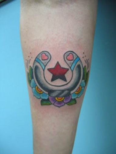 Color Flowers And Horseshoe Tattoo On Forearm