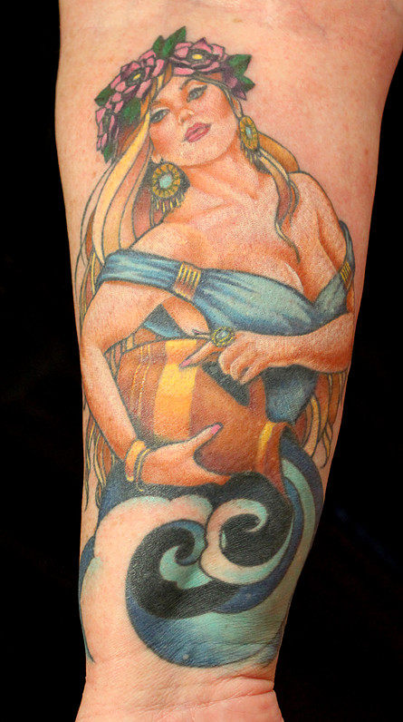 Colored Aquarius Mermaid Tattoo On Forearm