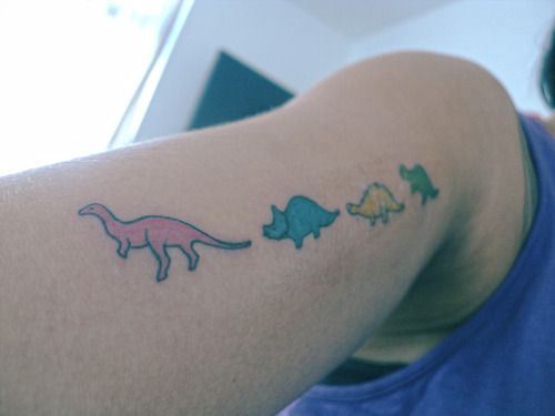 Colored Dinosaur Tattoo On Half Sleeve