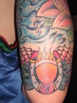 Colored Horseshoe Tattoo On Half Sleeve