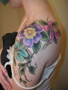 Colorful Hibiscus Flowers Tattoo On Girl Left Shoulder By Claire