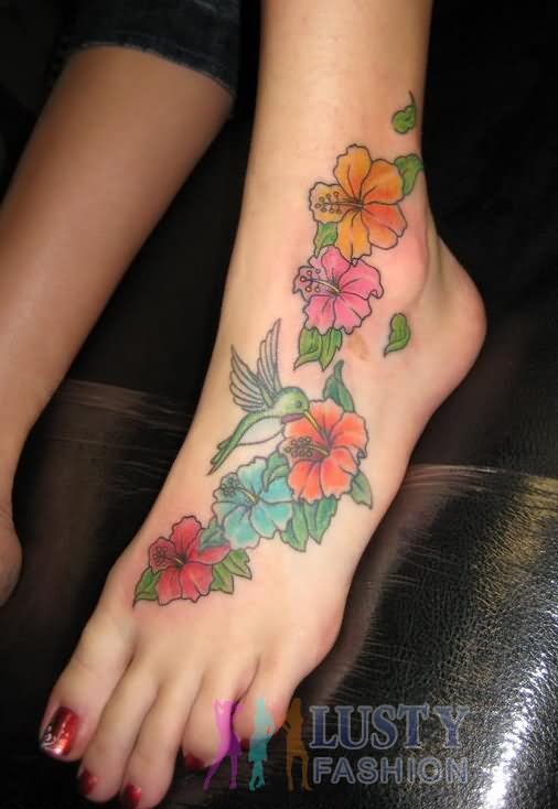 Colorful Hibiscus Flowers With Bird Tattoo On Girl Left Foot