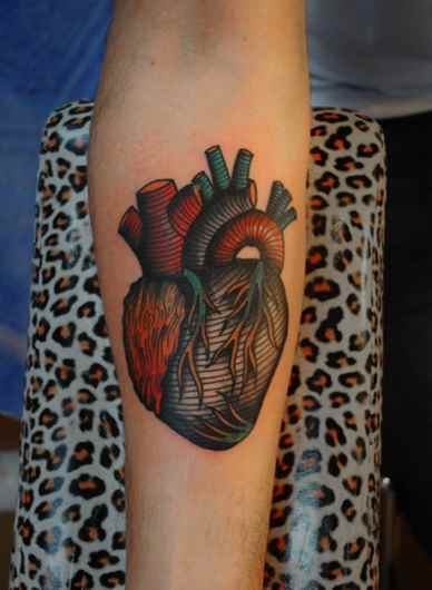 Colorful Real Heart Tattoo On Right Forearm