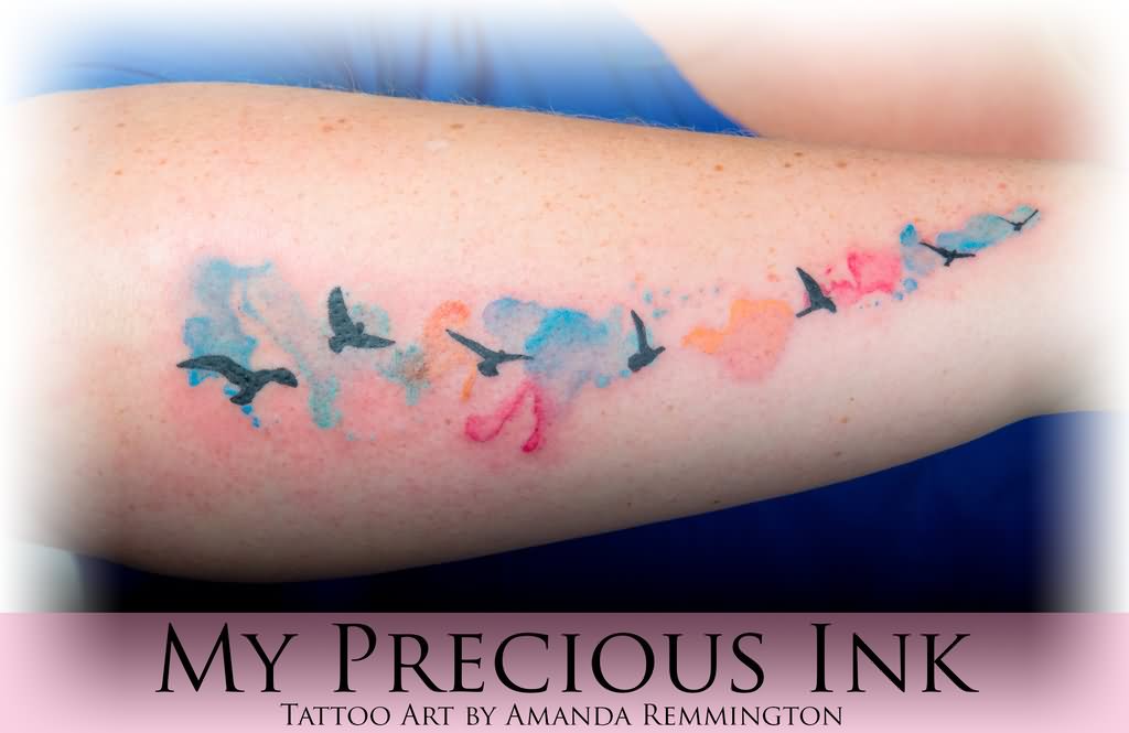 Colorful Watercolor Flying Birds Tattoo Design For Forearm By Mentjuh