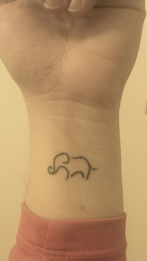 Cool Black Outline Elephant Tattoo On Girl Wrist