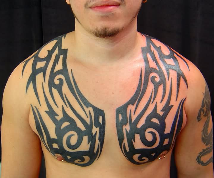 Cool Black Tribal Tattoo On Man Chest