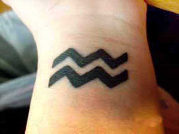 Cute Black Aquarius Tattoo On Left Wrist