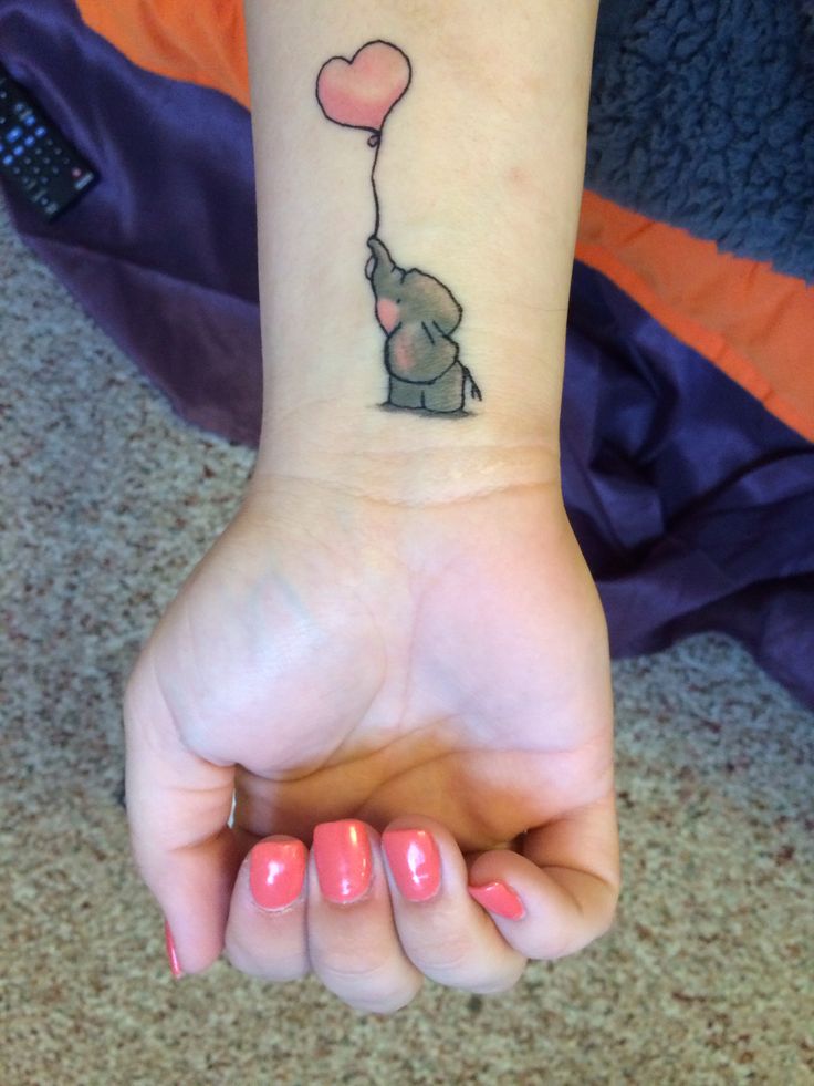 Cute Elephant Trunk Up With Balloon Tattoo On Girl Wrist
