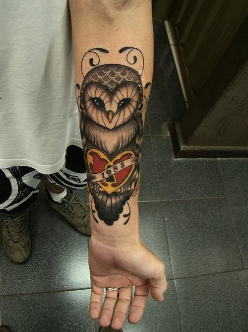 Cute Owl With Heart And Banner Tattoo On Left Forearm