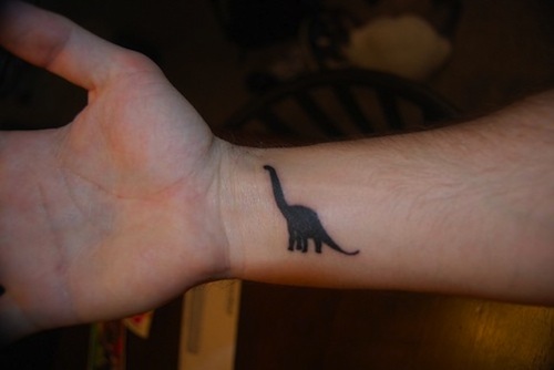 Dinosaur Tattoo On Right Wrist