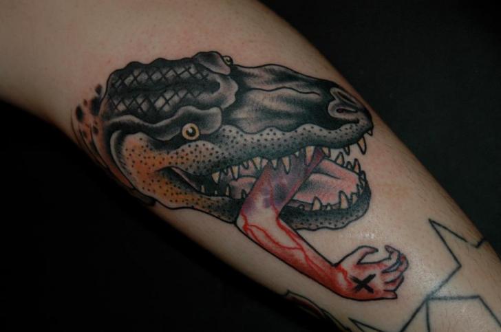 Dinosaur With Arm In Mouth Tattoo On Arm