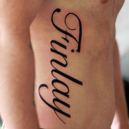 Finlay Lettering Tattoo On Man Right Side Rib